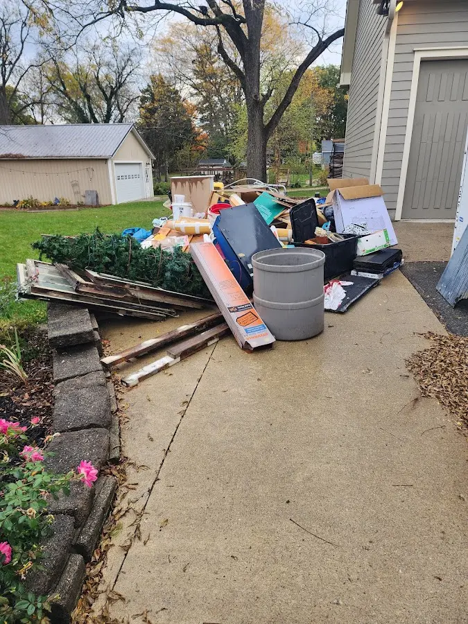 Dumpster being loaded with debris for 3 Yard Dumpster Rental in Saddlebrooke